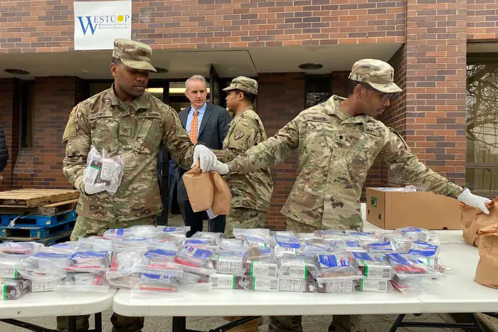 The National Guard passing out food at WestCOP, a New Rochelle community center